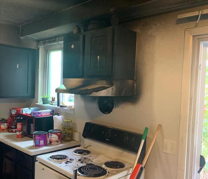 Kitchen with smoke damage from a grease fire