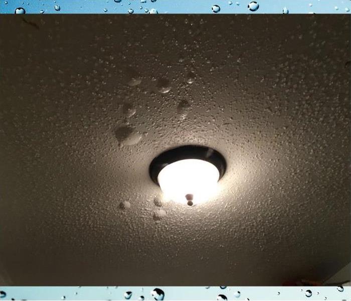 paint bubbling on the ceiling due to water  from above